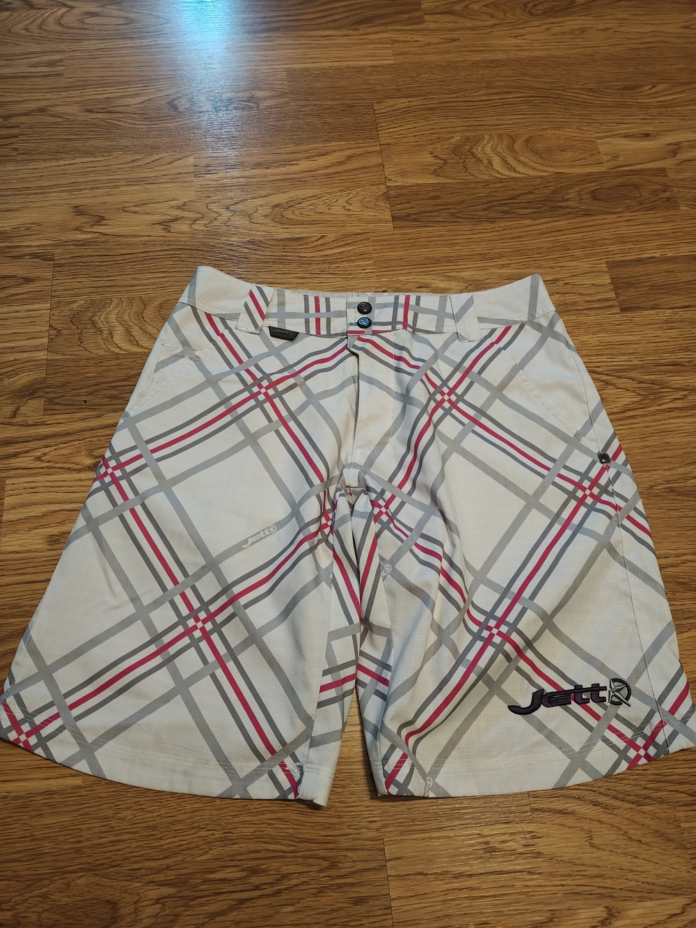 Women's White Plaid Mountain Bike Shorts with Gray and Pink Accents